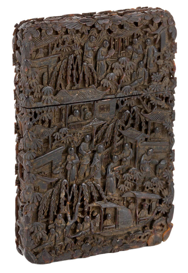
	
		A Chinese tortoiseshell card case, mid- 19th century, intricately carved with figures in...