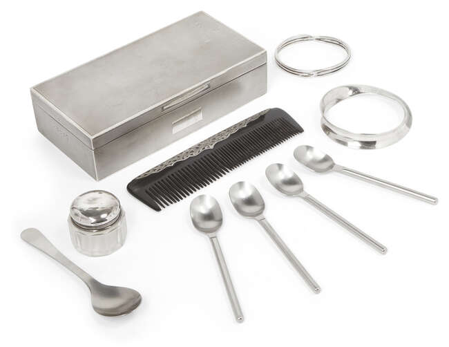 
	
		A George V silver cigarette box, Birmingham, c.1934, John Rose, of engine-turned design...