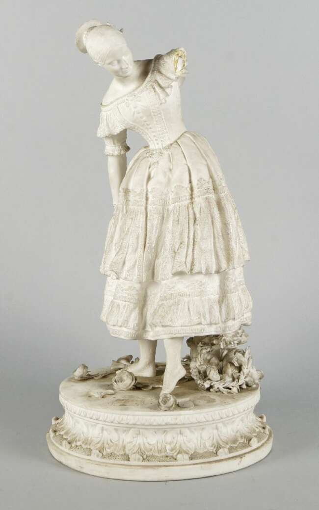 
	
		A Continental white bisque porcelain model of a woman, late 19th/early 20th century,...