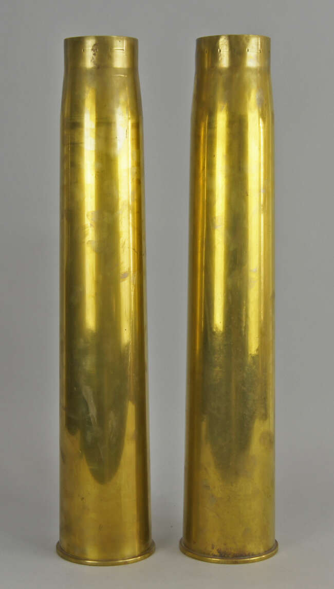 
	
		A pair of large World War brass 3.7 inch anti-aircraft gun shell cases, dated 1939 and...