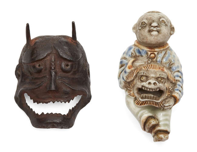 
	
		A Japanese porcelain netsuke, 19th century, modelled as a Chinese boy holding a lion...