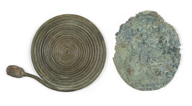 
	
		Two Italic bronze fibulae, circa 8th century B.C. , 10cm. diam. and 10.2cm. diam. (2)
		