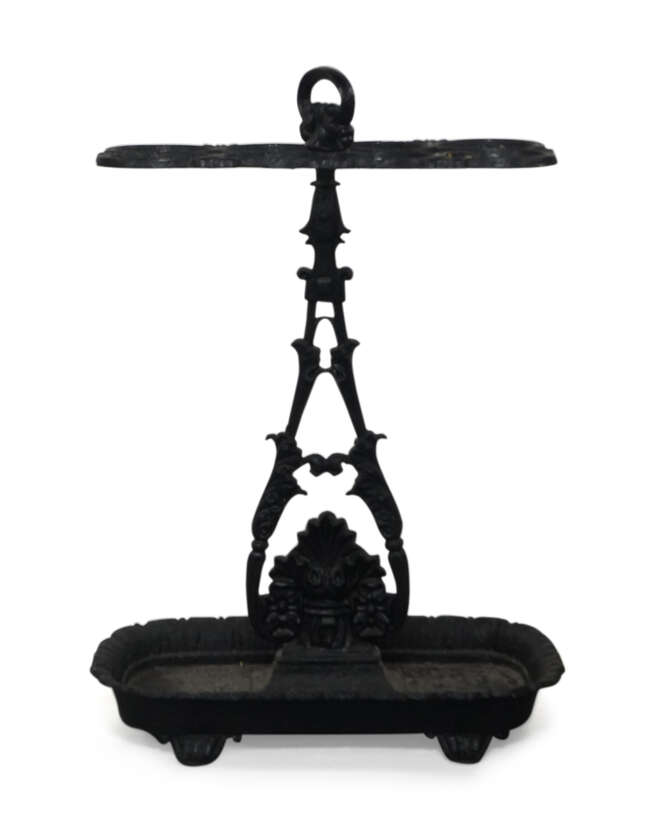 
	
		An early Victorian black-painted cast-iron stick stand, mid 19th century, after a design...