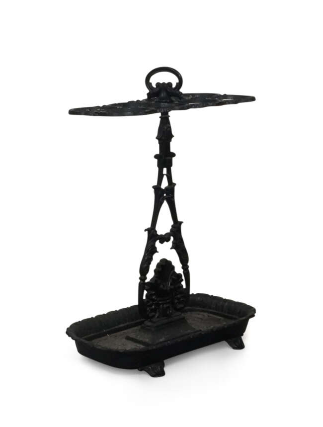 
	
		An early Victorian black-painted cast-iron stick stand, mid 19th century, after a design...
