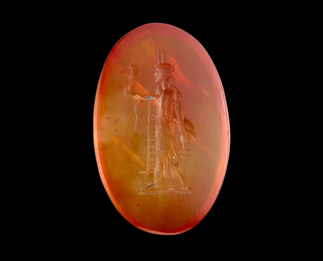 A Graeco-Egyptian carnelian intaglio of a Deity,Ptolemaic to Roman period, circa 1st century...