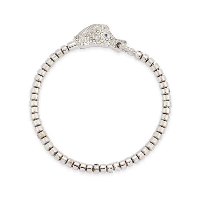 A diamond set horse bracelet, composed of a diamond set horse's head with sapphire eyes, the...