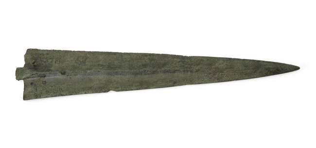 A heavy Bronze Age bronze short sword with leaf-shaped blade and pronounced midrib, cylindrical...