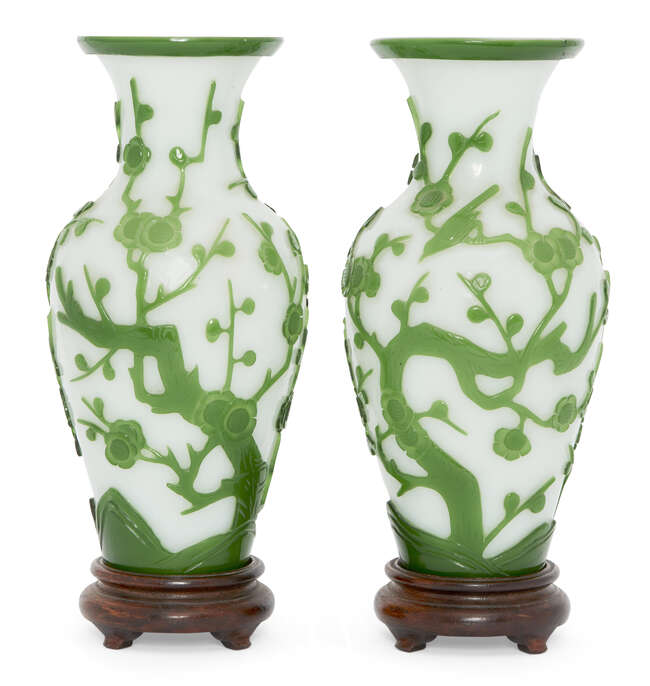 
	
		A pair of Chinese Peking green-overlay glass vases, late 19th century, carved with...