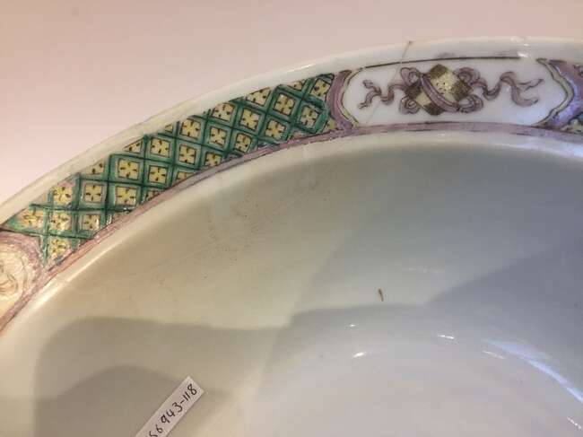 
	
		A Chinese porcelain boy and chicken bowl, 19th century, painted in famille verte enamels...