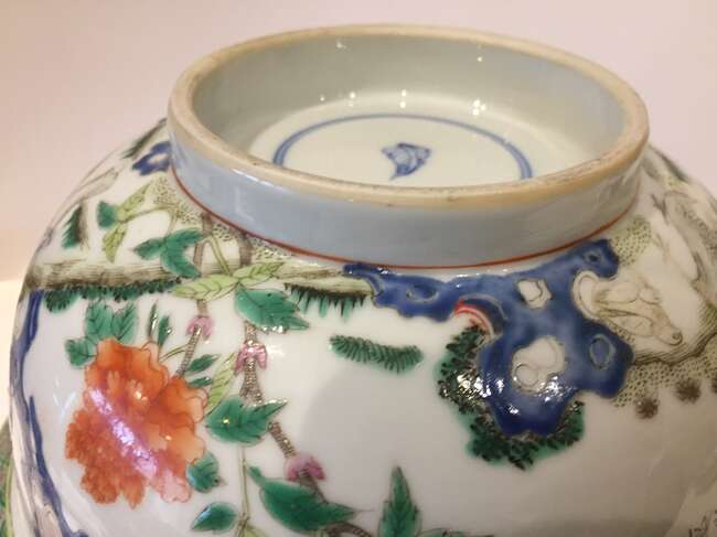 
	
		A Chinese porcelain boy and chicken bowl, 19th century, painted in famille verte enamels...