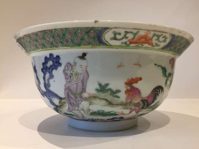 
	
		A Chinese porcelain boy and chicken bowl, 19th century, painted in famille verte enamels...