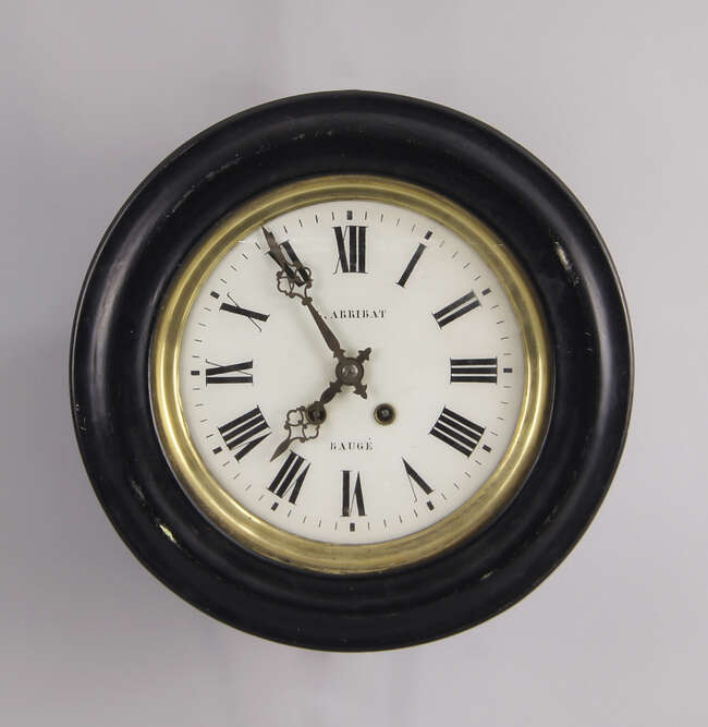 
	
		A French circular wall clock, late 19th century, with an ebonised case, the white painted...