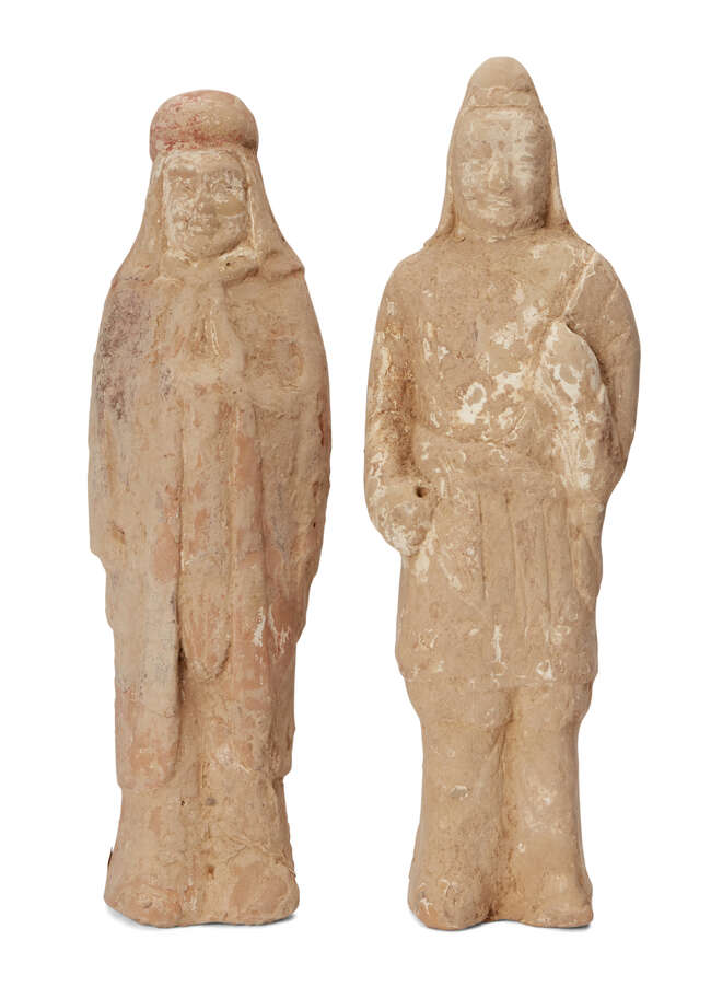 
	
		Two Chinese pottery tomb figures, Sui/Tang dynasty, each modelled as standing court...