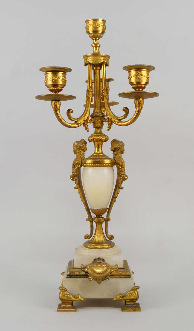 
	
		A French gilt metal and alabaster four light candelabra, late 19th century, with female...