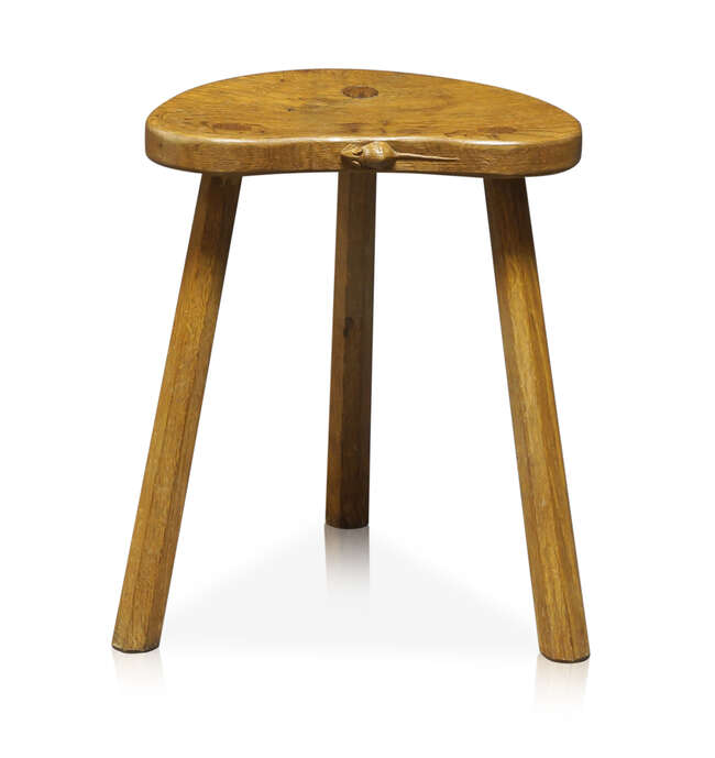 
	
		Robert Thompson (1876-1955), a Mouseman English oak three-legged stool
		c.1970, signed...