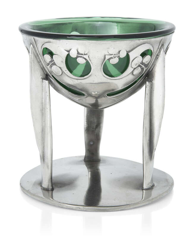 
	
		Archibald Knox (1864-1933) for Liberty & Co, 
		 
		Tudric comport with green glass...