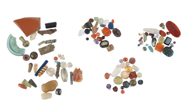 
	
		A large group of Egyptian faience amulets and glass beads (a quantity)  

	

