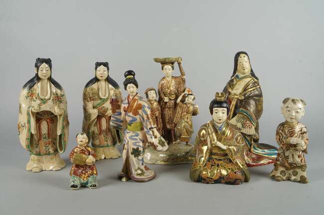 
	
		A pair of Japanese Satsuma figures of ladies, 20th century, onw holding a scroll 226cm...