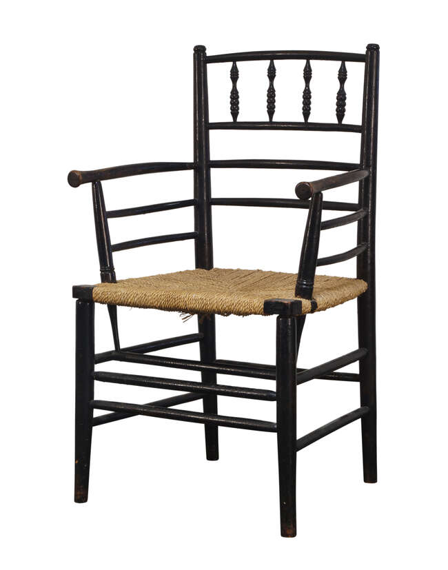 
	
		William Morris & Co, an ebonised &#39;Sussex&#39; type armchair,
		Late 19th Century,
		With...