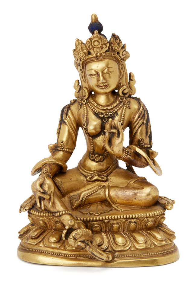 
	
		A Sino-Tibetan gilt bronze figure of Green Tara, early 20th century, seated in lalitasana...