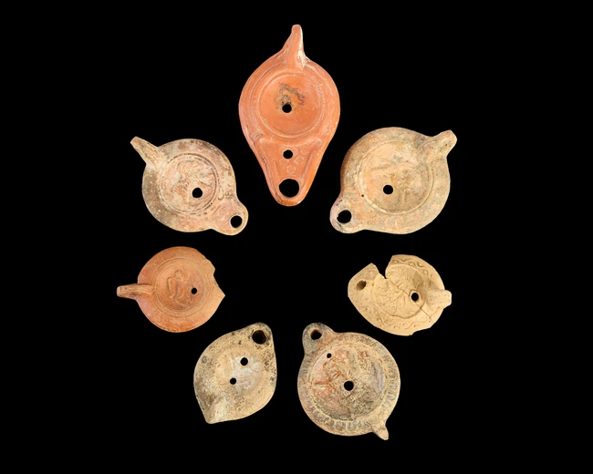 Seven complete and incomplete Roman pottery oil lamps, 1st - 5th Century A.D., including a Roman...