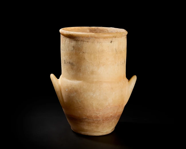 A sizeable Egyptian alabaster vase, New Kingdom, circa 1279-1213 B.C.
with vestigial handles...