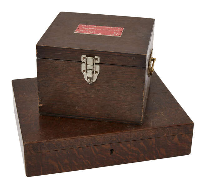 
	
		A Masonic working tools presentation box, early 20th century, to include: wood gavel,...