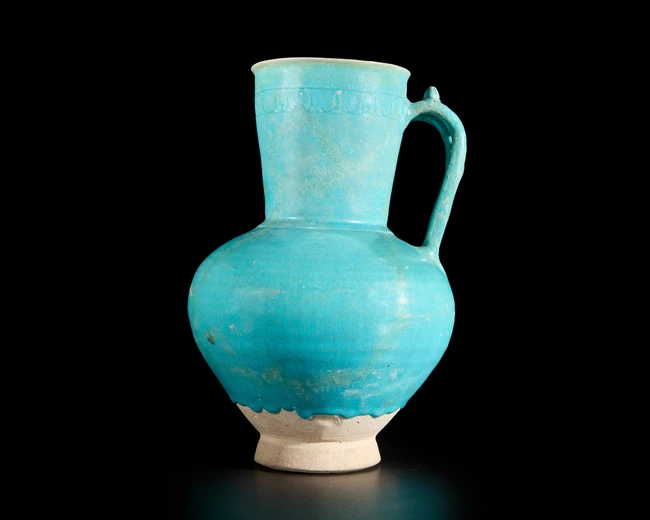 A globular turquoise blue glazed pottery jug, Ilkhanid central Iran, 12th/13th century, 
On...