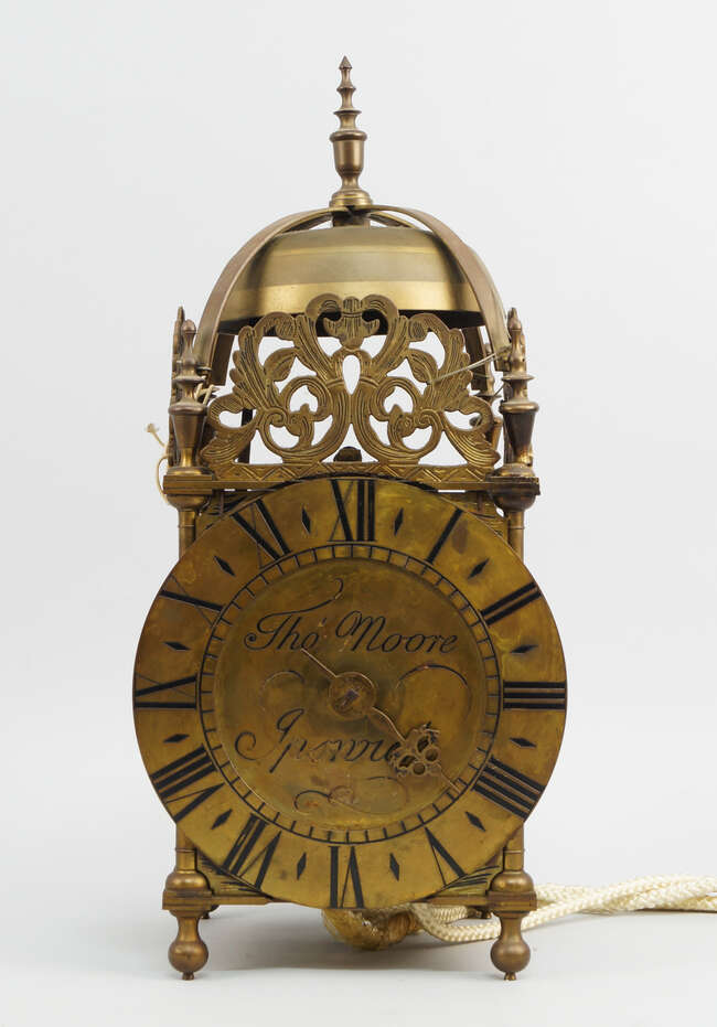 
	
		A brass lantern clock, in the 17th  century style, signed to the dial Thomas Moore, with...