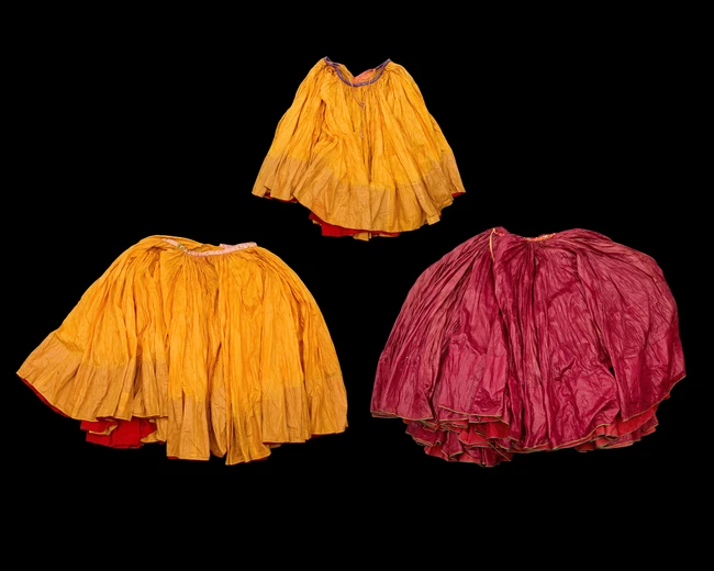 Three nautch skirts, India, early 20th century, 
Pleated,
80cm. high
(3)