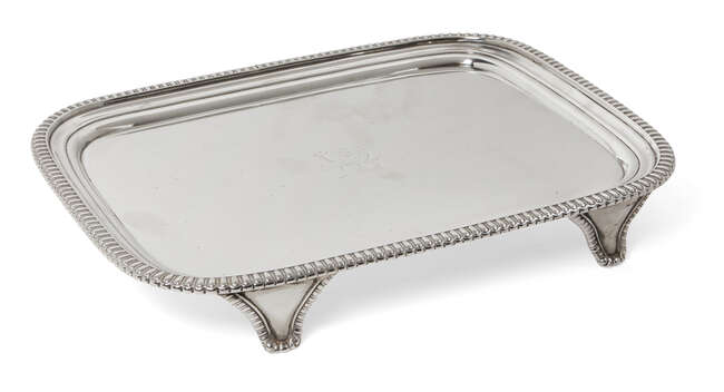 
	
		A George III silver stand, London, c.1811, William Bennett, of oblong form with gadroon...