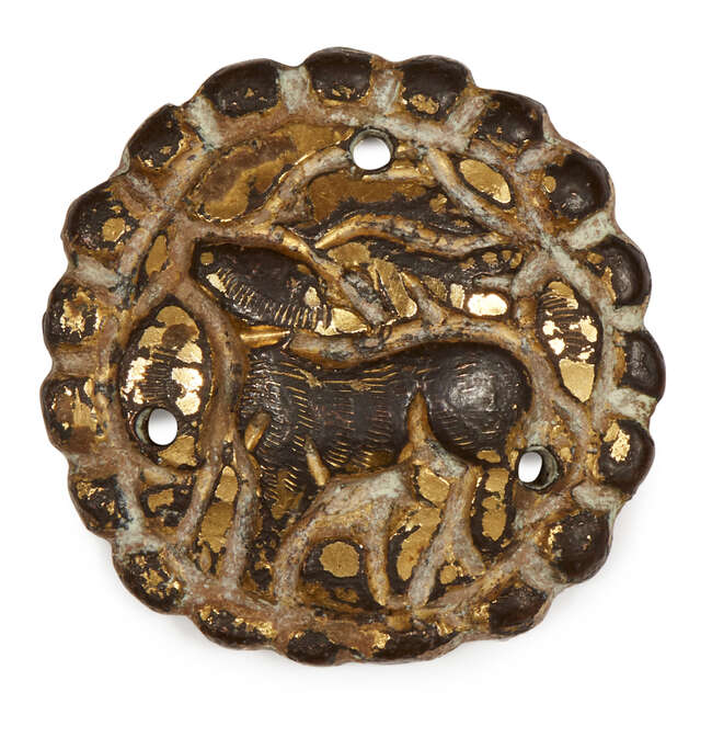 
	
		A gilded silver button, Iran, 11th century, the central reserve depicting a deer cast in...