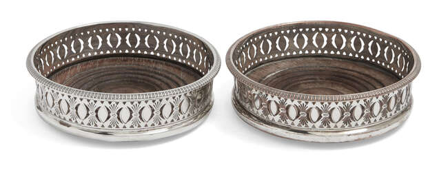 A pair of 19th century silver plated wine coasters, with turned wooden bases and gadroon edge to...