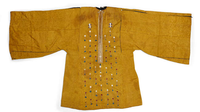 
	
		An embroidered silk shirt, Sa&#39;ada Yemen, late 19th-20th century, the ochre-coloured silk...