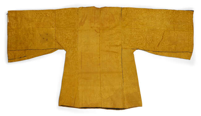 
	
		An embroidered silk shirt, Sa&#39;ada Yemen, late 19th-20th century, the ochre-coloured silk...