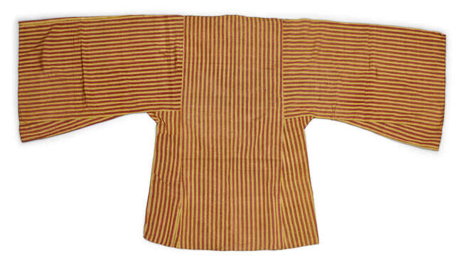 Two embroidered silk shirts, Sa'ada Yemen, late 19th-20th century, the ochre-coloured silk...