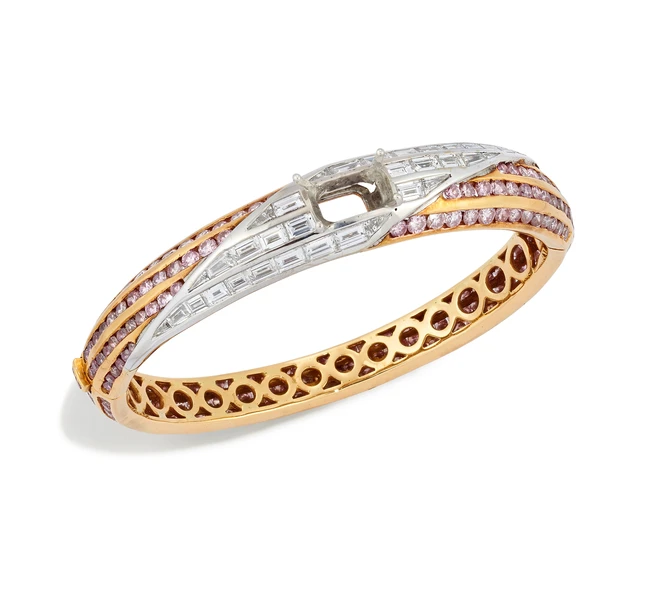 Graff. A diamond and pink diamond bangle, with a rectangular-shape vacant collet, to a...