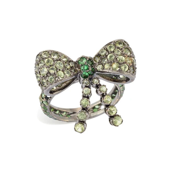 A green sapphire and tsavorite bow brooch, with articulated green sapphire set components, to a...