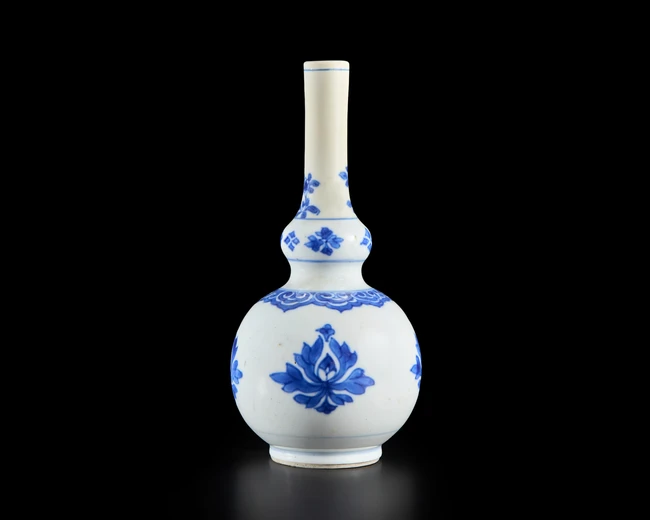 A small spherical blue and white perfume or rose water sprinkler, China for the export market,...