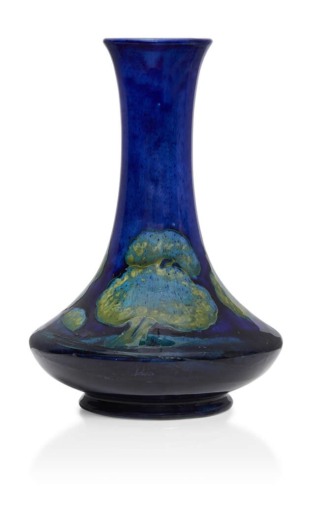 
	
		William Moorcroft (1872-1945), a Moonlit Blue pattern ceramic vase 
		c.1925, signed W...