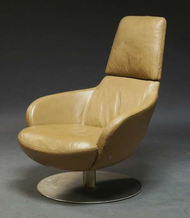 
	
		Natuzzi, a &#39;Brend&#39; swivel arm chair, of recent manufacture, upholstered in brown leather...