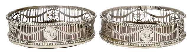 
	
		A pair of pierced silver wine coasters, London, c.1772, John Lambe, with beaded edges and...
