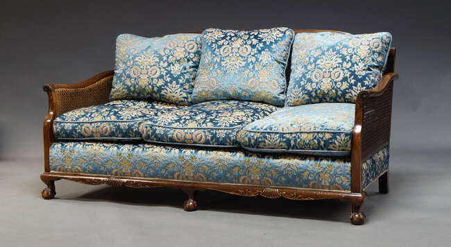 
	
		A mahogany and caned bergere suite, early 20th Century, comprising three seater sofa,...