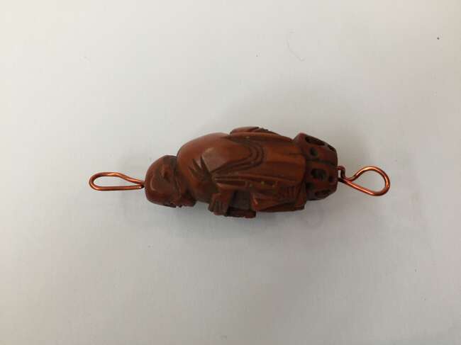 
	
		A Chinese hediao nut and stand, early 20th century, carved as a boat and inscribed to the...