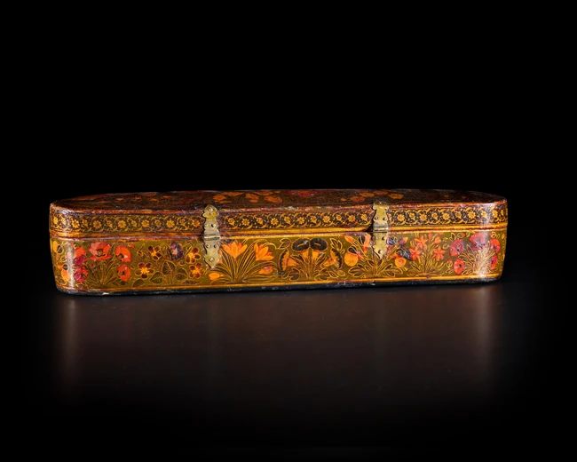 A large signed composite Safavid lacquered papier mâché pencase (qalamdan), Persia, late 17th...