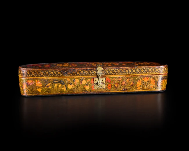 A large signed composite Safavid lacquered papier mâché pencase (qalamdan), Persia, late 17th...
