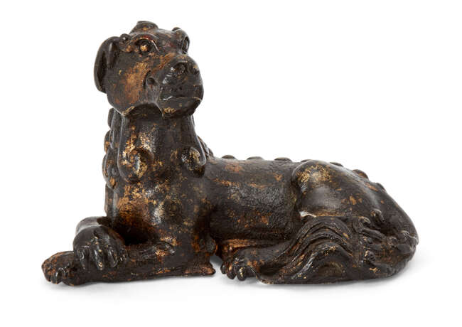 
	
		A Chinese parcel gilt bronze &#39;mythical beast&#39; scroll weight, Ming dynasty, cast with...
