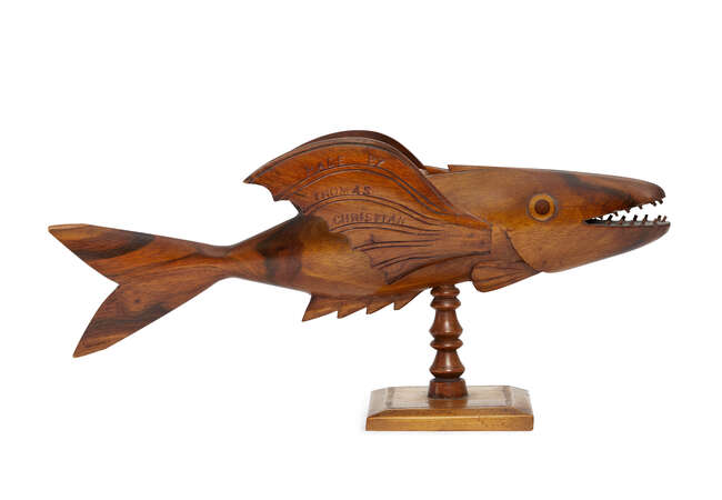 
	
		A Pitcairn Island carved wood model of a flying fish, 20th century, inscribed FROM...