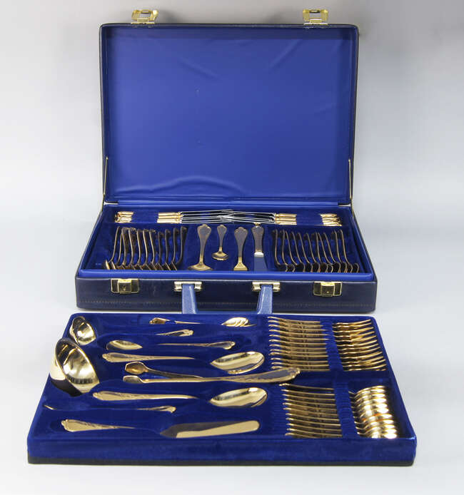 
	
		A cased canteen of German gold plated cutlery, Rostfrei, Solingen, Germany, twelve place...
