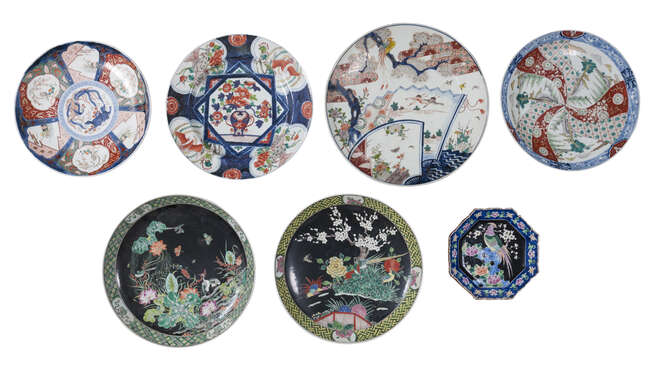 Seven Japanese porcelain charges
Early 20th century
Painted in enamels with birds amongst...